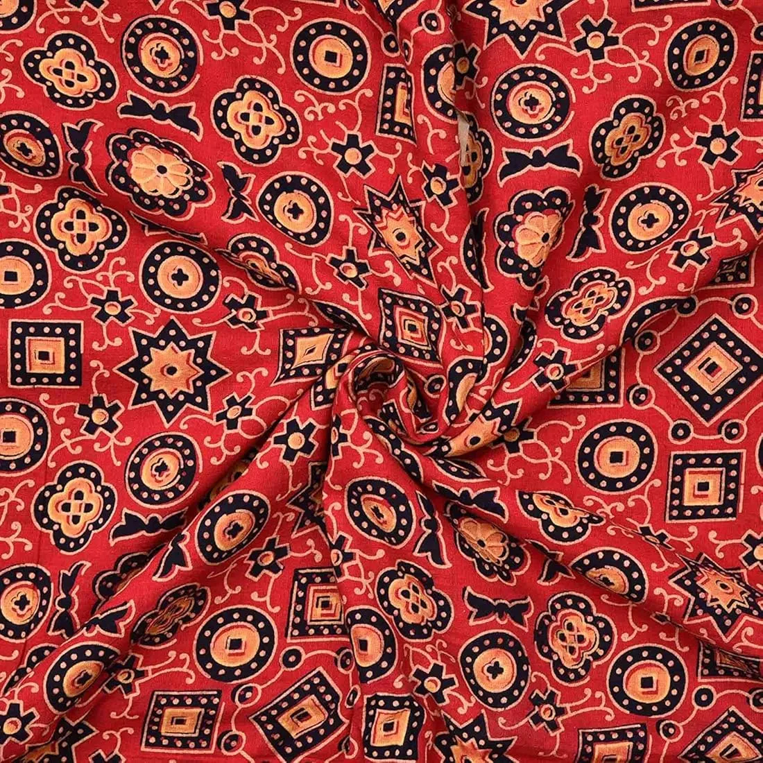 Carved wooden blocks pressing resist paste onto fabric for Ajrakh in Kutch