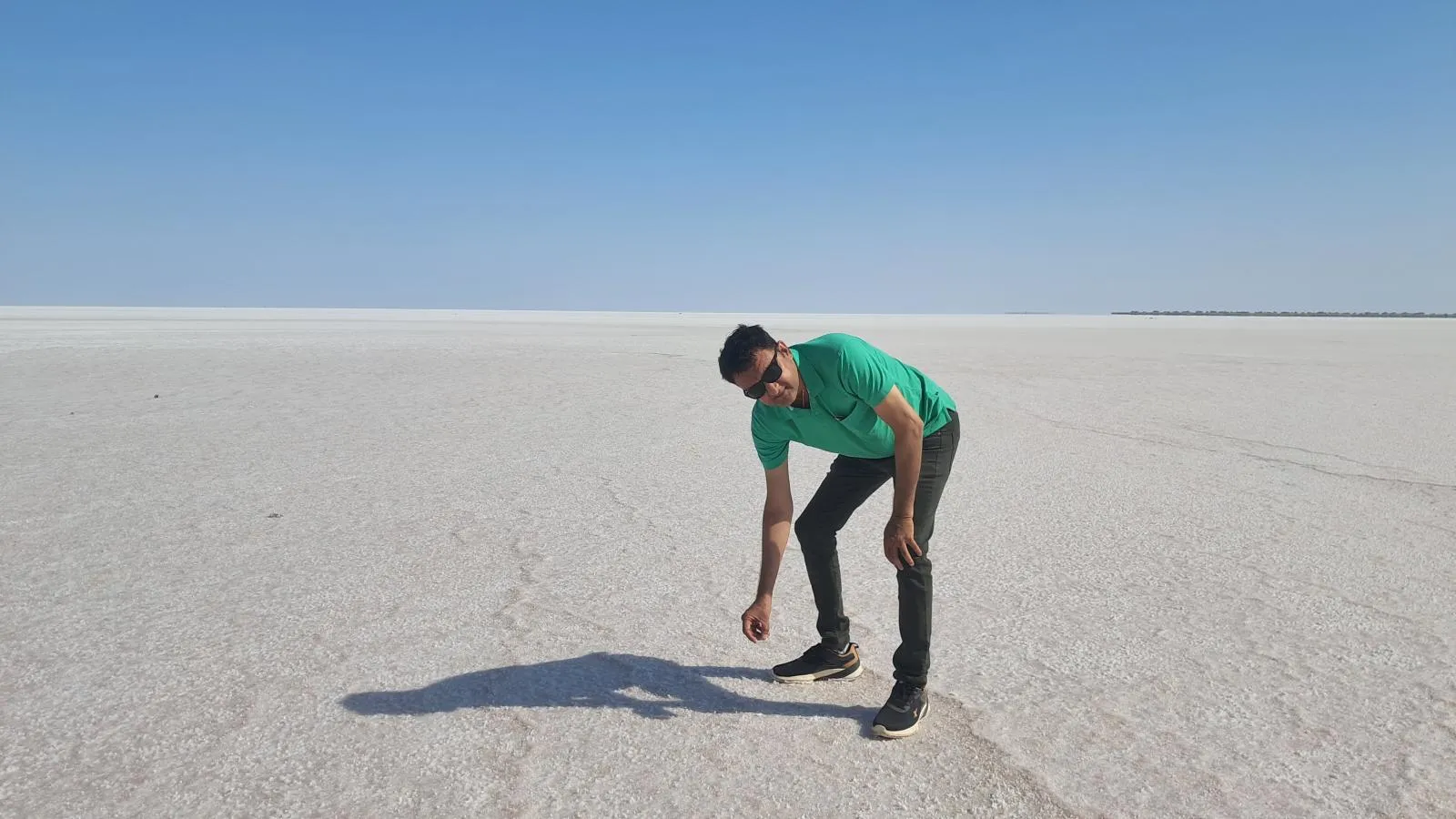 Salt flats with reflective patches in Kutch